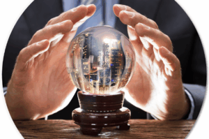 A man in a business suit and tie holds his hands over a crystal ball, in which he sees skyscrapers.